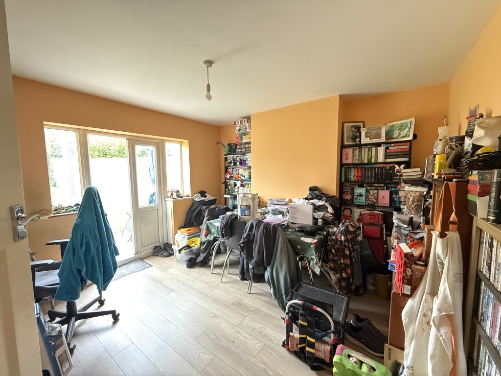 Lot: 156 - FREEHOLD HOUSE FOR INVESTMENT - Dining room with painted walls and laminate floor